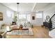 Spacious living room with light walls and a stylish chandelier at 4490 W 45Th Ave, Denver, CO 80212