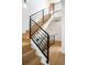 Stylish staircase with modern metal railing and wood steps at 4490 W 45Th Ave, Denver, CO 80212