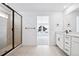 Modern bathroom featuring a glass-enclosed shower and a stylish vanity area at 16671 W 93Rd Ave, Arvada, CO 80007