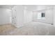 Bright and spacious bedroom with plush carpeting, a walk-in closet, and a large window at 16671 W 93Rd Ave, Arvada, CO 80007