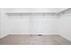Walk-in closet with basic shelving, ready for customization and organization at 16671 W 93Rd Ave, Arvada, CO 80007