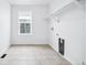 Dedicated laundry room with tile flooring, hookups, and shelving for storage at 16671 W 93Rd Ave, Arvada, CO 80007