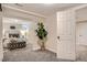 Open basement area leading to bedroom with modern decor, neutral colors and recessed lighting with carpet flooring at 1818 S Humboldt St, Denver, CO 80210