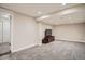 Spacious finished basement with plush carpeting, recessed lighting, and ample room for entertainment or recreation at 1818 S Humboldt St, Denver, CO 80210