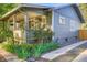 Charming home exterior with well-manicured landscaping, cozy front porch, and inviting curb appeal at 1818 S Humboldt St, Denver, CO 80210