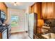 Well-equipped kitchen featuring stainless steel appliances and classic wood cabinetry at 1818 S Humboldt St, Denver, CO 80210