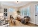 Cozy living room boasts large windows, comfortable seating, and a warm, inviting atmosphere at 1818 S Humboldt St, Denver, CO 80210