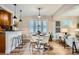 Open-concept living space featuring a modern kitchen, dining area, and stylish living room at 1818 S Humboldt St, Denver, CO 80210