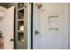 Modern shower with white tile, recessed shelves and bronze shower head at 1818 S Humboldt St, Denver, CO 80210