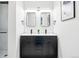 Elegant bathroom featuring a dual sink vanity with sleek fixtures and modern lighting at 1100 Gaylord St, Denver, CO 80206