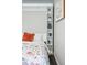 Comfortable bedroom featuring a cozy murphy bed with decorative shelves at 1100 Gaylord St, Denver, CO 80206