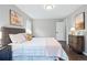 Comfortable bedroom featuring hardwood floors, a stylish dresser, and a relaxing atmosphere at 1100 Gaylord St, Denver, CO 80206