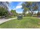 Inviting view of Cheesman Park sign nestled in a green lawn and mature trees, promising an outdoor experience at 1100 Gaylord St, Denver, CO 80206