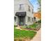 Charming two-story building with brick facade, tidy lawn, and landscaped garden beds flanking the entrances at 1100 Gaylord St, Denver, CO 80206