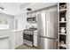 Bright kitchen features stainless steel appliances, ample storage, and a sleek design for modern convenience at 1100 Gaylord St, Denver, CO 80206