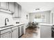 Well-equipped kitchen boasts stainless steel appliances, modern cabinetry, and a bright dining area for enjoyable cooking at 1100 Gaylord St, Denver, CO 80206