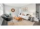 Cozy living room features a comfortable sofa, stylish chairs, and a large window for ample natural light at 1100 Gaylord St, Denver, CO 80206