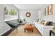 Cozy living room features a comfortable sofa, stylish chairs, and a large window for ample natural light at 1100 Gaylord St, Denver, CO 80206