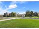 Picturesque park view featuring manicured lawns and walking paths leading to a pavilion and city buildings at 1100 Gaylord St, Denver, CO 80206