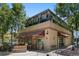 Charming view of Shells & Sauce Restaurant with outdoor seating and a welcoming corner building facade at 1100 Gaylord St, Denver, CO 80206