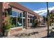 Charming storefront featuring large display windows, planters, brick and awnings inviting customers inside at 1100 Gaylord St, Denver, CO 80206