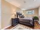Cozy bedroom features hardwood floors, a queen bed and neutral decor at 3265 S Ogden St, Englewood, CO 80113