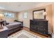 Charming bedroom with wood floors, area rug and chest of drawers at 3265 S Ogden St, Englewood, CO 80113