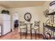 Kitchen and dining space featuring wood floors, a table with chairs, and white refrigerator at 3265 S Ogden St, Englewood, CO 80113