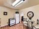 Kitchen and dining area featuring wood floors, a table with chairs, and white appliances at 3265 S Ogden St, Englewood, CO 80113
