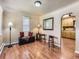 Inviting living room featuring wood floors, a window with blinds, and neutral wall color at 3265 S Ogden St, Englewood, CO 80113