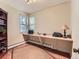 Well-lit office space with large built in desk, bookshelf and natural light at 3265 S Ogden St, Englewood, CO 80113