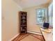 Bright office with built in desk and bookshelf by window at 3265 S Ogden St, Englewood, CO 80113