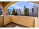 Cozy balcony view overlooking modern townhomes and lush greenery, inviting relaxation and outdoor enjoyment at 150 S Harrison St # 9, Denver, CO 80209