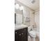 Clean bathroom featuring a shower and bathtub combo, a vanity with storage, and neutral decor at 150 S Harrison St # 9, Denver, CO 80209