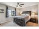 Bedroom with a large window, ceiling fan, neutral colors and carpeted floor at 150 S Harrison St # 9, Denver, CO 80209