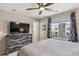 Bedroom featuring neutral decor, a ceiling fan, carpet and large window at 150 S Harrison St # 9, Denver, CO 80209