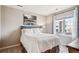 Bedroom with a cozy bed, a large window providing ample natural light, and stylish decor at 150 S Harrison St # 9, Denver, CO 80209