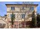 Two-story home with a brick facade and landscaped garden with a large bare tree in the front yard at 150 S Harrison St # 9, Denver, CO 80209