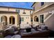 Inviting outdoor patio with comfortable wicker furniture, perfect for entertaining and enjoying al fresco dining at 150 S Harrison St # 9, Denver, CO 80209