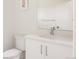 Clean bathroom featuring a white vanity with chrome fixtures and a modern toilet with coordinated wall art at 2321 S Acoma St, Denver, CO 80223