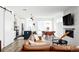 Bright, open living area featuring a stylish kitchen, dining space, and a comfortable leather sofa at 2321 S Acoma St, Denver, CO 80223
