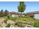 Spacious backyard with a well-maintained lawn, garden beds, and mature landscaping at 10712 Larson Dr, Northglenn, CO 80233
