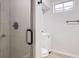 Bathroom featuring updated shower and sleek vanity with modern fixtures at 10712 Larson Dr, Northglenn, CO 80233