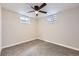 Bedroom features two windows for natural light and a ceiling fan at 10712 Larson Dr, Northglenn, CO 80233