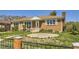 Charming brick home with manicured lawn, complemented by decorative fencing at 10712 Larson Dr, Northglenn, CO 80233