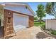 Exterior view of the garage featuring a brick driveway, and convenient access at 10712 Larson Dr, Northglenn, CO 80233