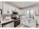 Modern kitchen equipped with stainless steel appliances, sleek cabinets, and ample counter space at 10712 Larson Dr, Northglenn, CO 80233