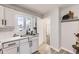 Bright kitchen with modern fixtures and finishes, complemented by a stylish sink and faucet at 10712 Larson Dr, Northglenn, CO 80233