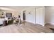 Comfortable living room showcasing seamless flow with the dining and kitchen areas at 10712 Larson Dr, Northglenn, CO 80233