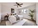 Bright main bedroom features a ceiling fan, natural light, and neutral tones at 10712 Larson Dr, Northglenn, CO 80233
